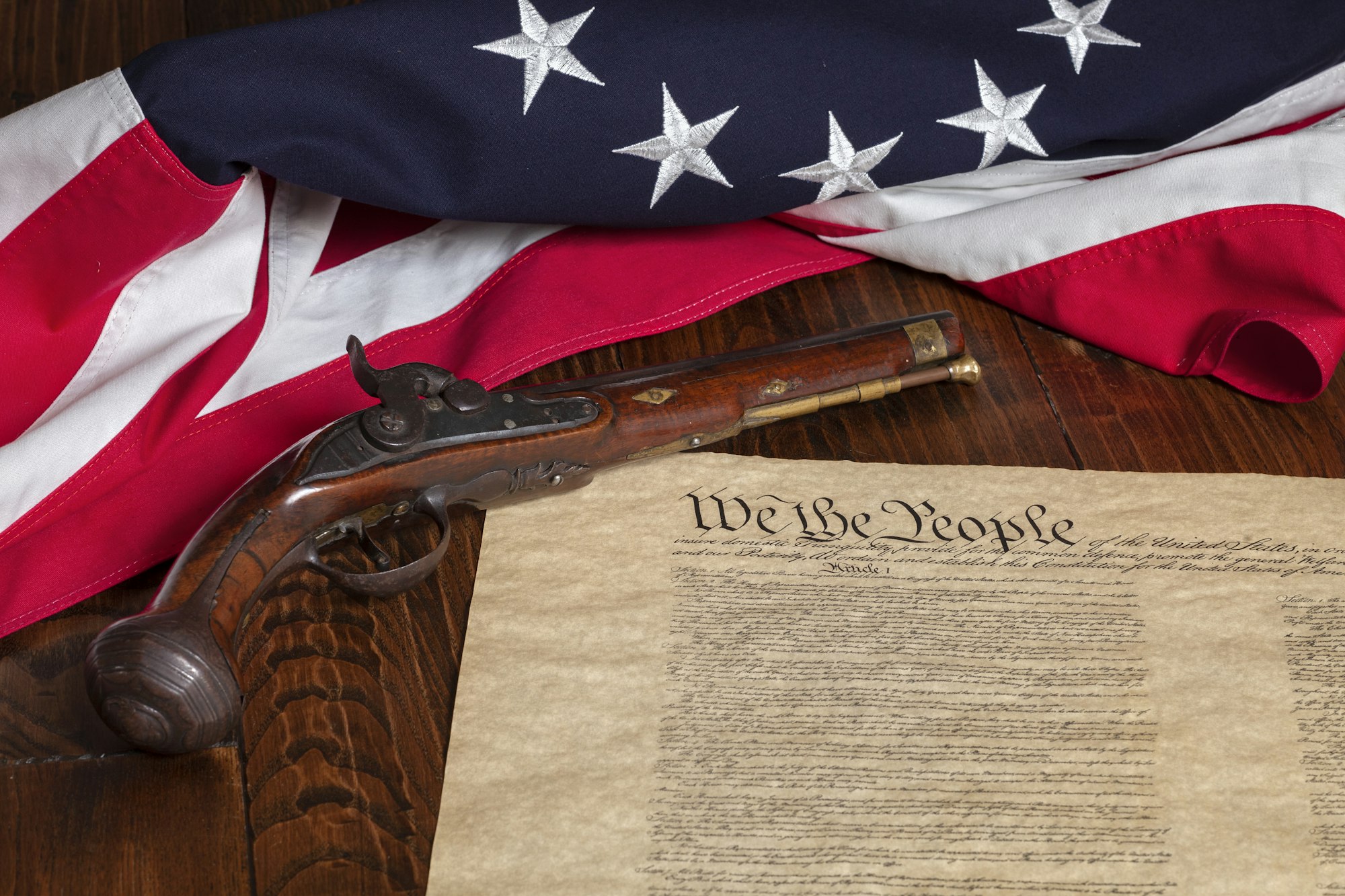 An illustration of the Fourth Amendment text with symbolic scales, representing the balance between privacy rights and law enforcement searches.